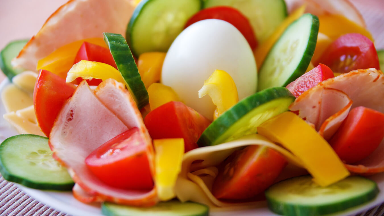 Salad Lyonnaise – Frisee Salad with Shallot Dijon Dressing, Bacon, and Poached Egg